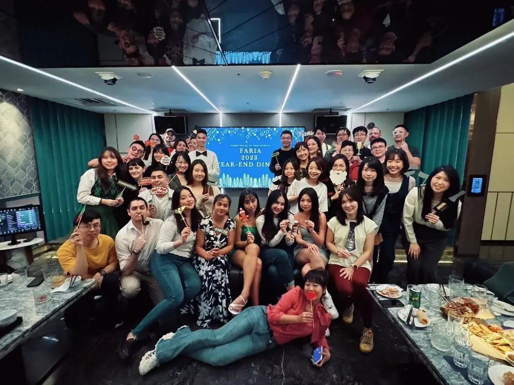 Group selfie at an office Christmas party