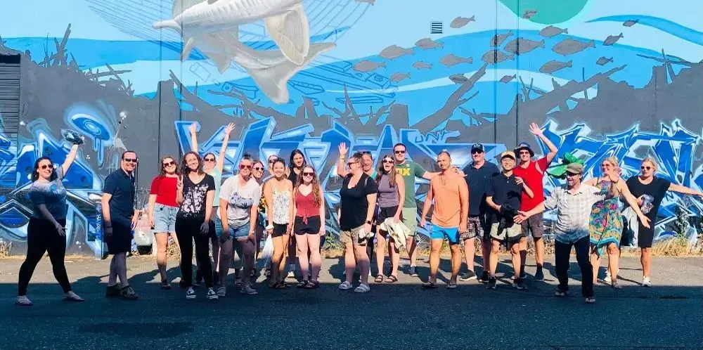 Group photo in front of graffiti
