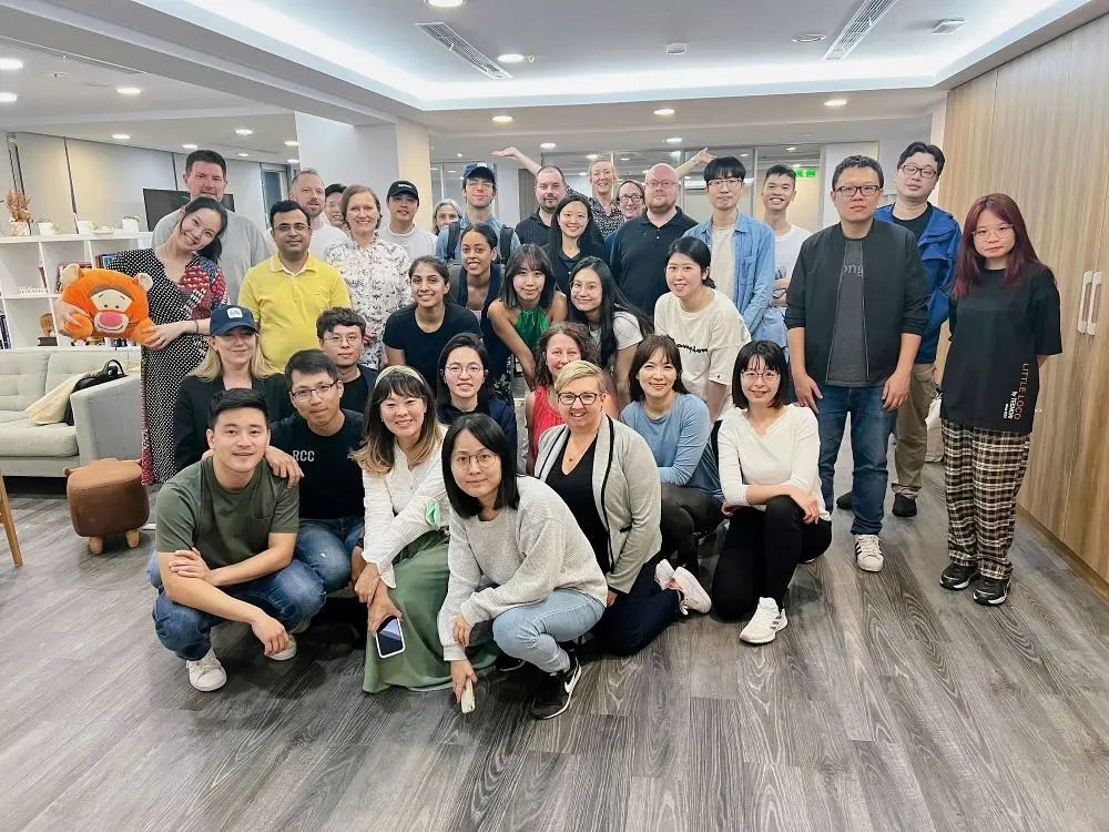 An office team pose for a group photo