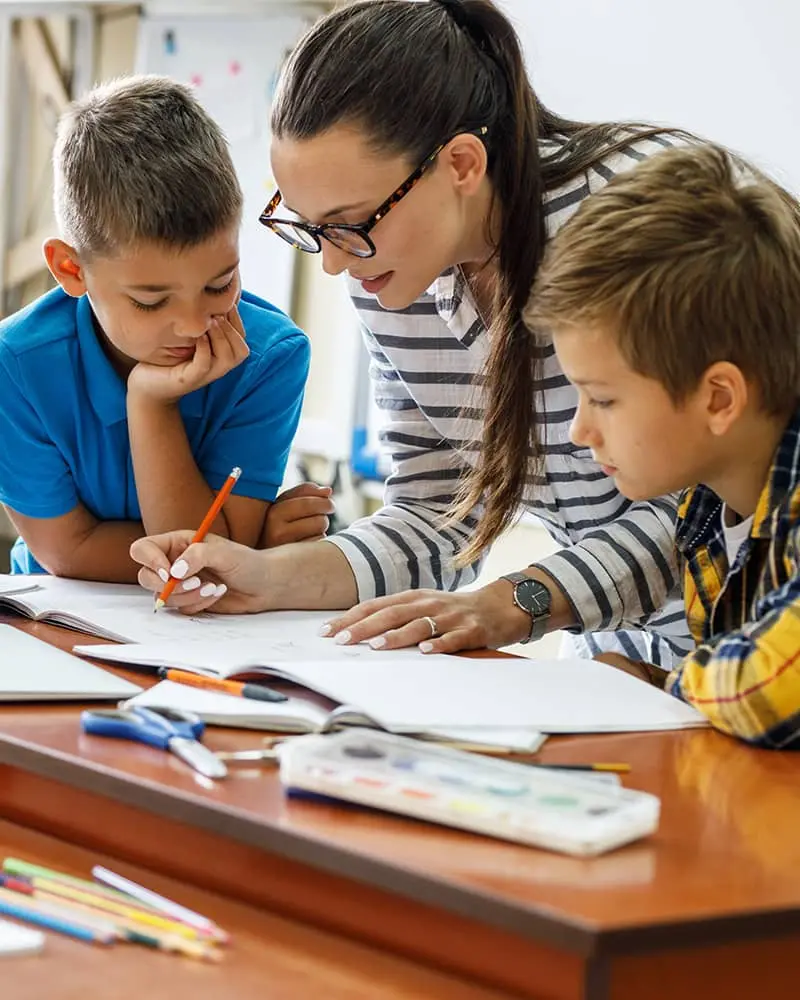 A teacher with two boys