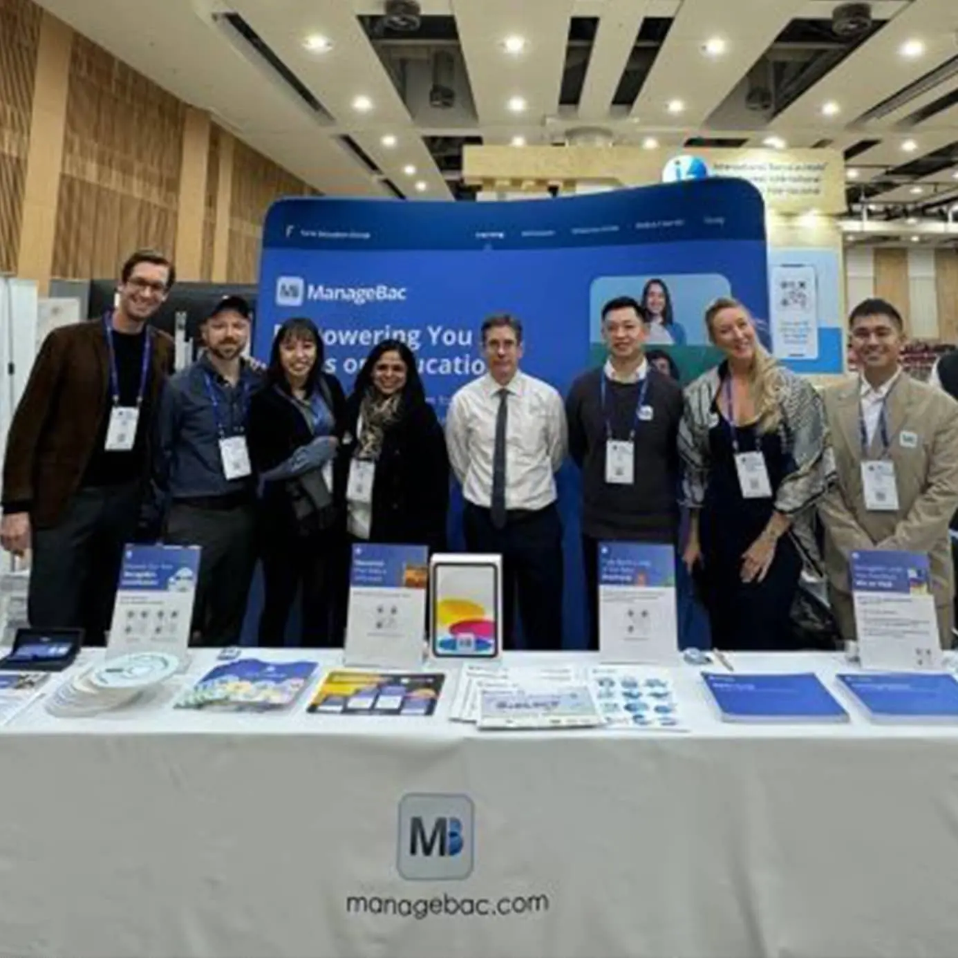 Group of people at stand at an exhibition