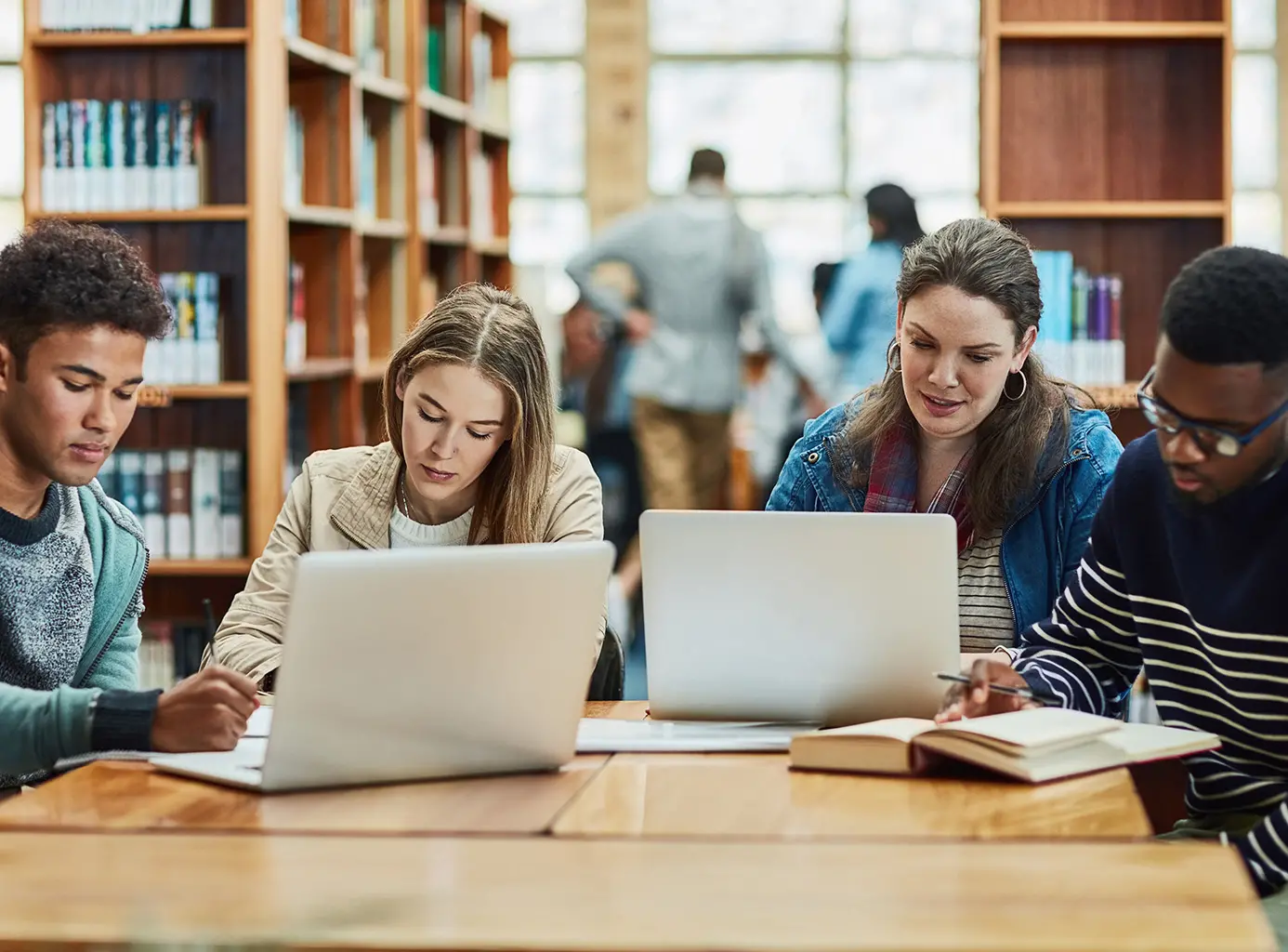 Four students studying in a school library